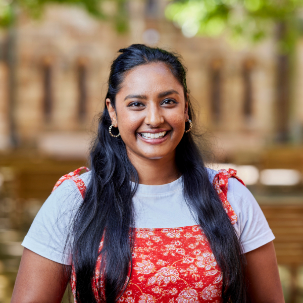Notre Dame student wearing red dress, standing near Fremantle Campus