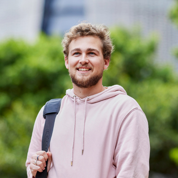 Notre Dame student wearing pink hoodie