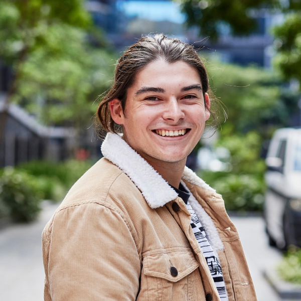 Undergraduate Sydney student wearing a brown jacket