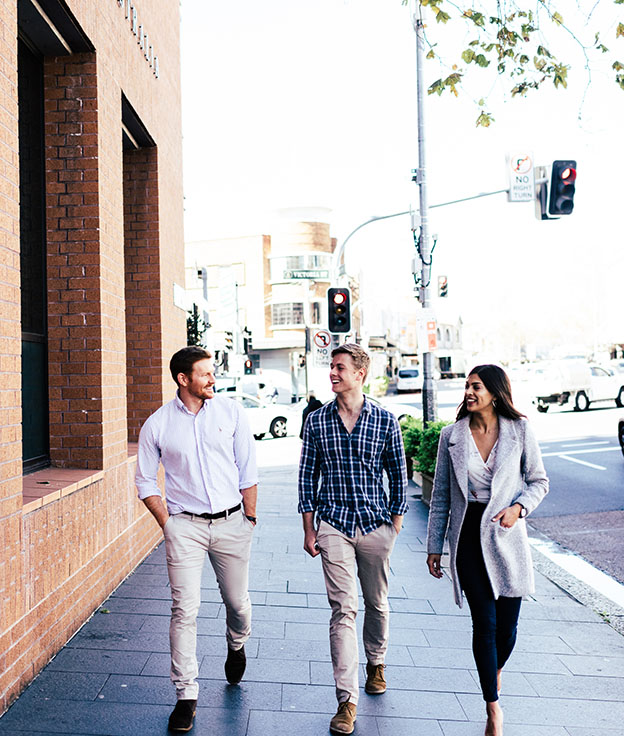 Three postgraduate Notre Dame students walking around the Sydney Darlinghurst campus 