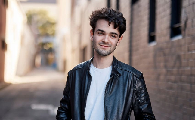 Notre Dame male law student wearing a black leather jacket in the Sydney campus 