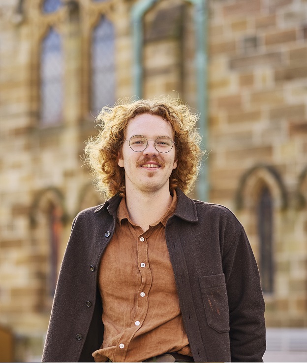 Sydney student standing in the courtyard on Broadway Campus